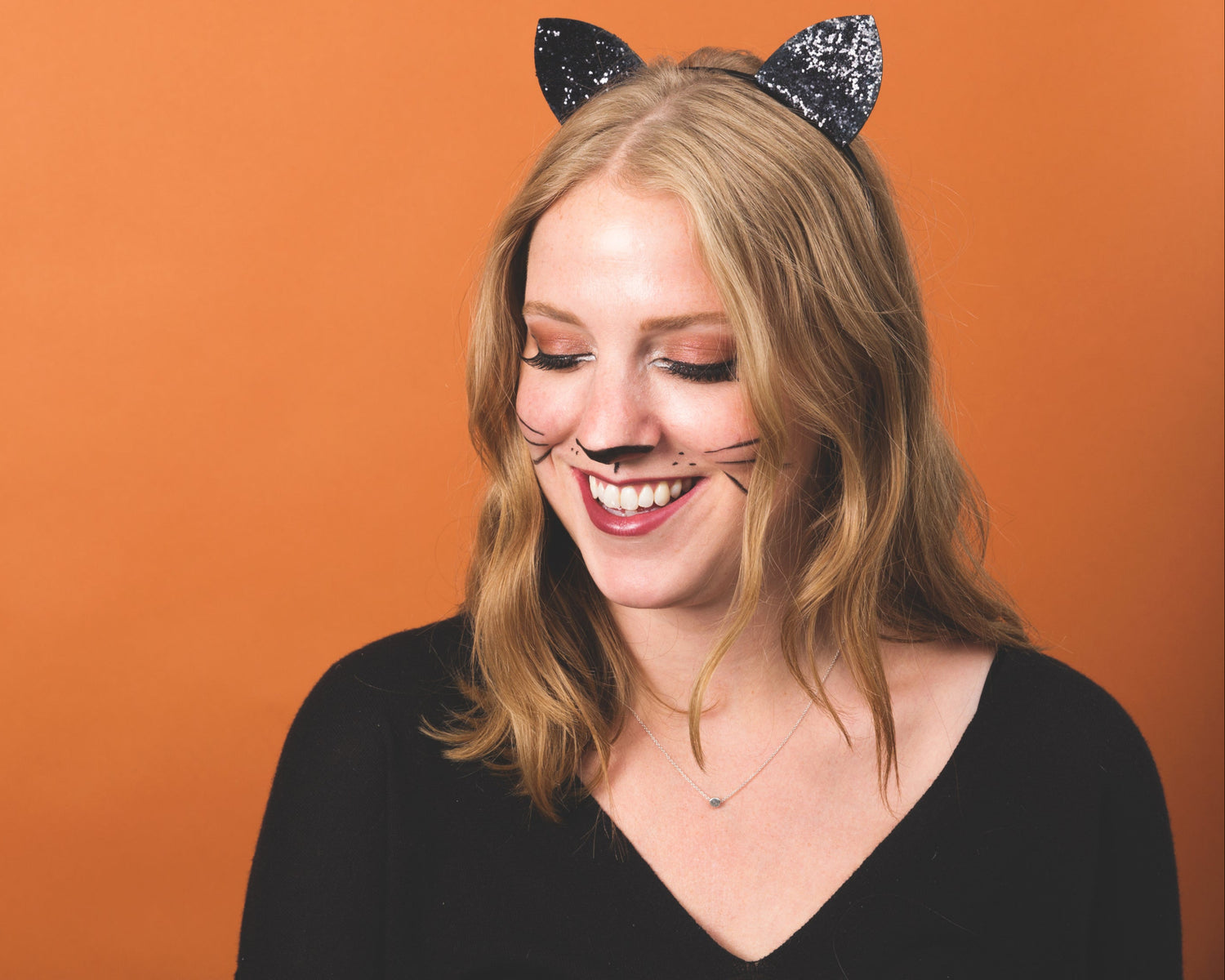 Cat lover wearing cat ears – representing Glow My Cat community and passion for feline care